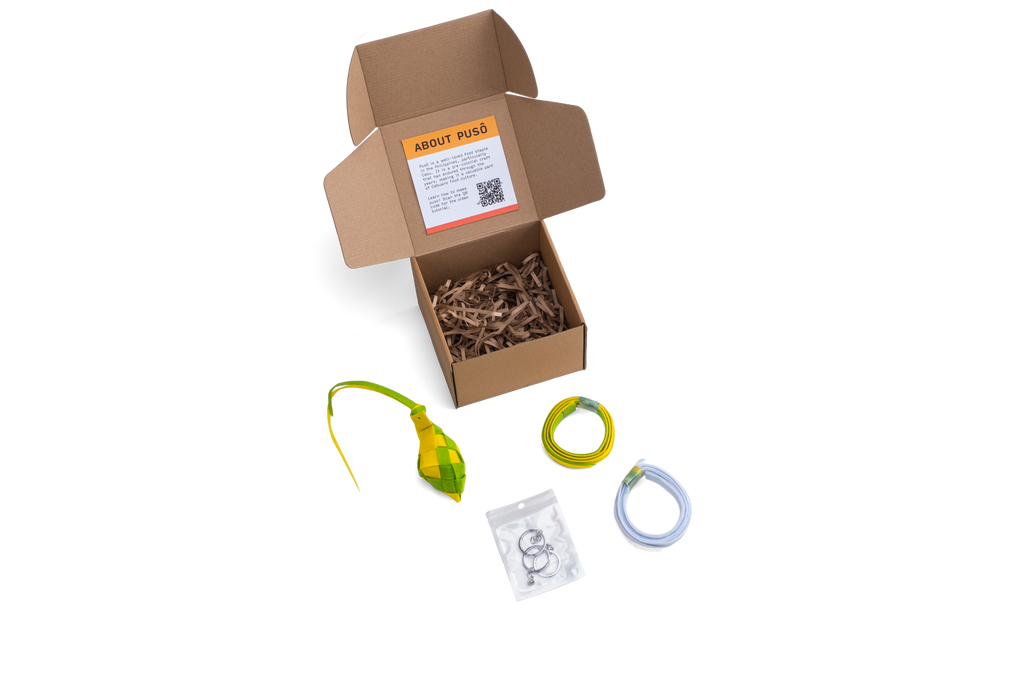 A photo of the Making Things Puso Making Kit inclusions outside its packaging. The kit includes 1 woven puso, 2 puso strips, 3 key rings, video tutorial.