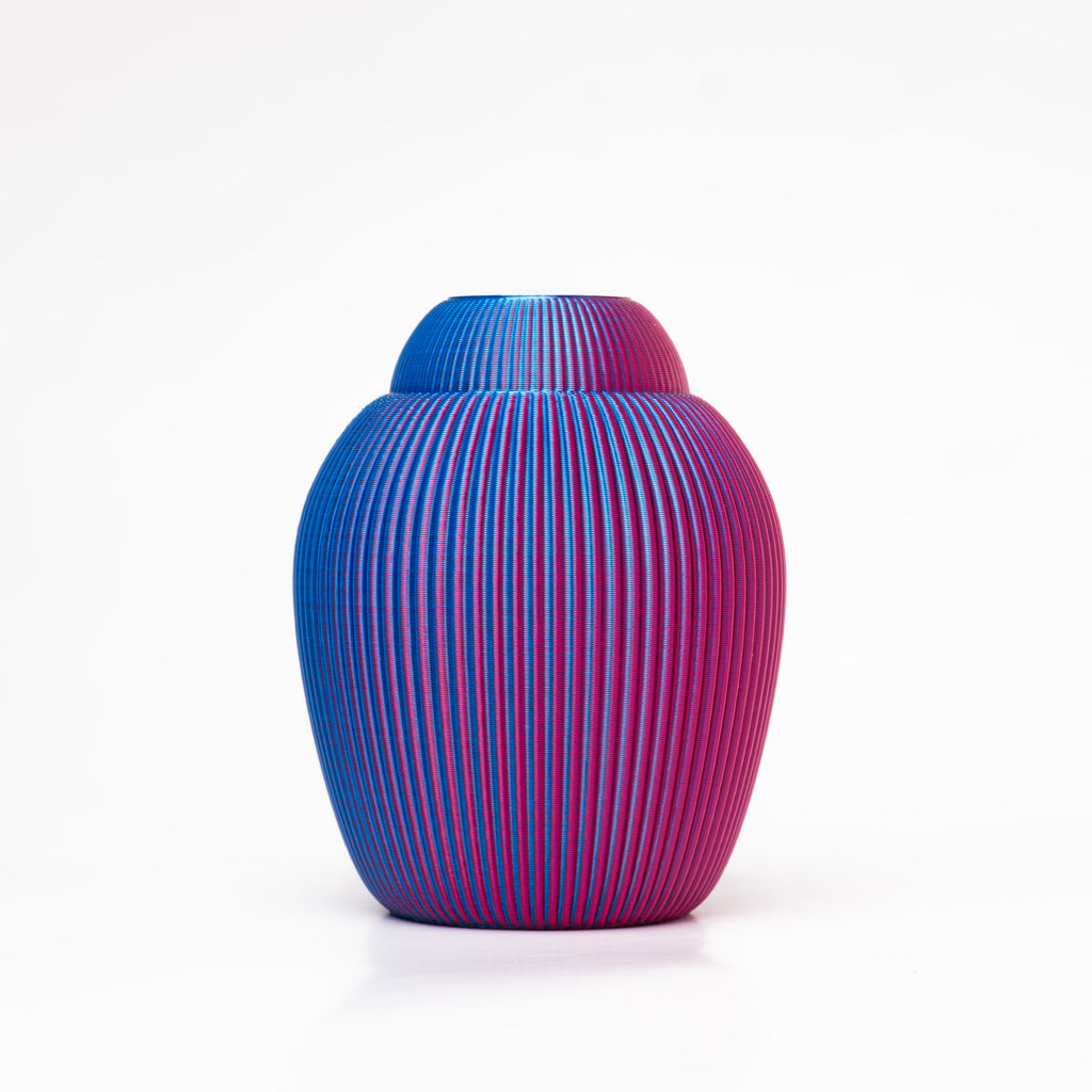 A 3D-printed iridescent vase that changes from blue to purple and vice versa.